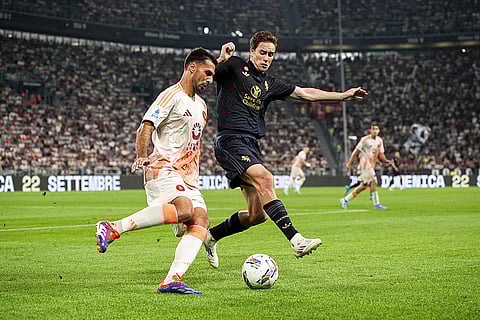 Serie A 2024-25 Juventus vs Roma: Roma's Zeki Celik fights for the ball with Juventus' Kenan Yildiz